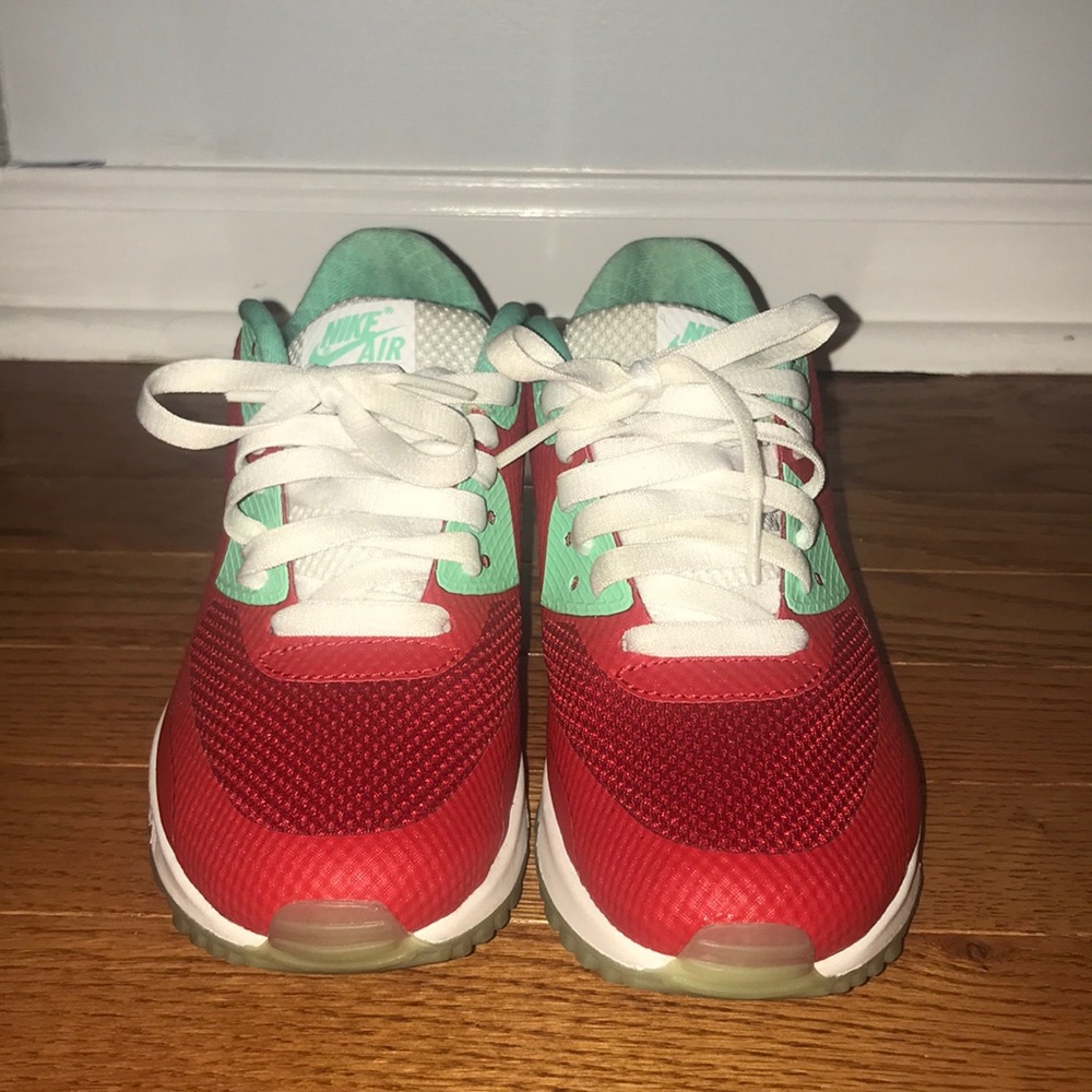 Green, red, and white Nike Air Max